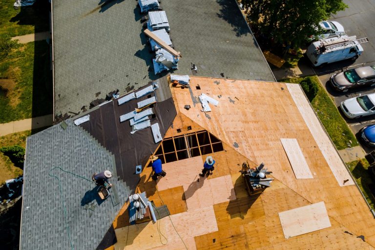 Roofing crew working on a house