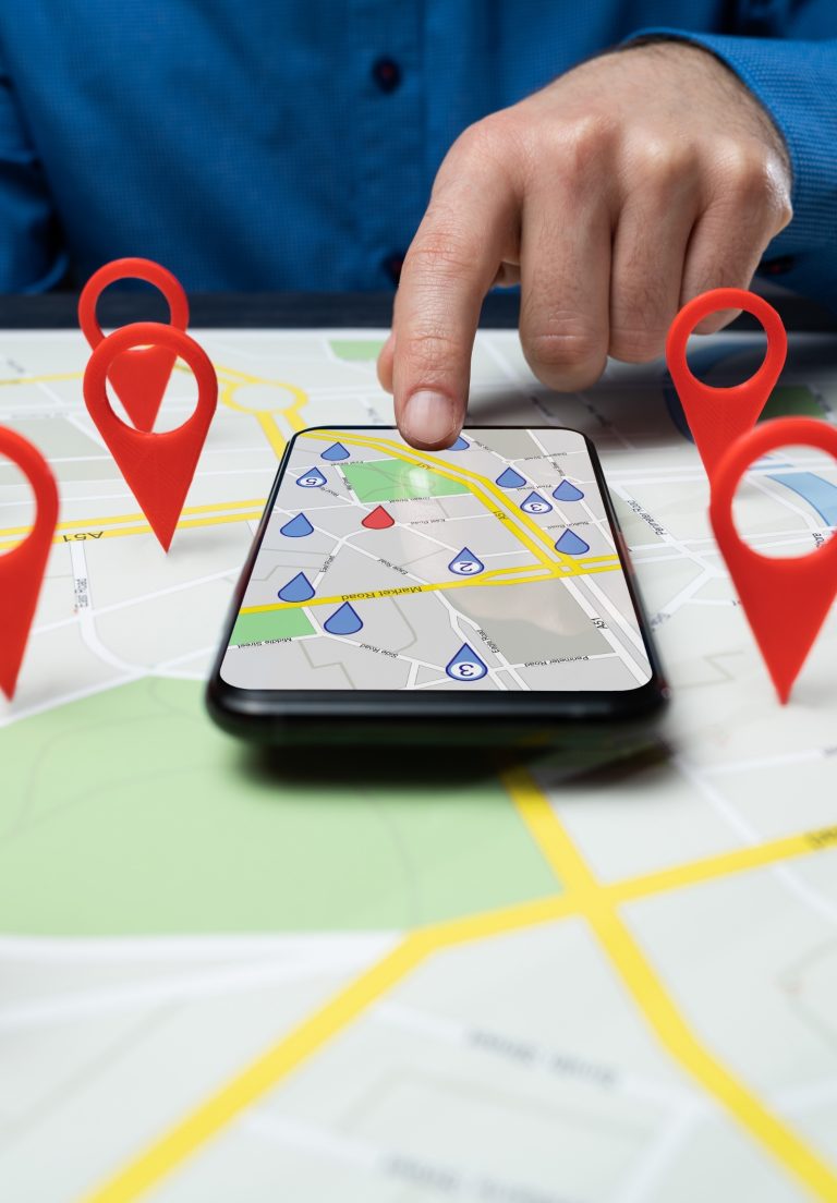 Phone showing local map results with business location pins